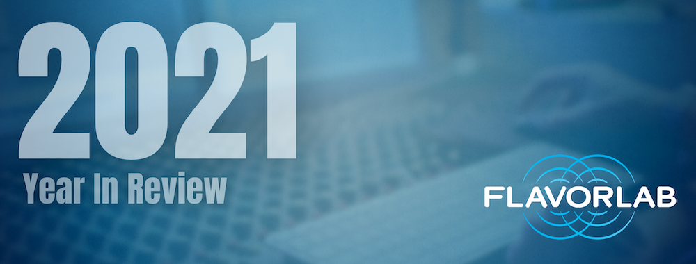 |||||||||||||||||||Image of a mixing board overlaid in a blue vignette with the words "2021 Year In Review" in white over top. The image features the Flavorlab logo in the bottom right hand corner.|