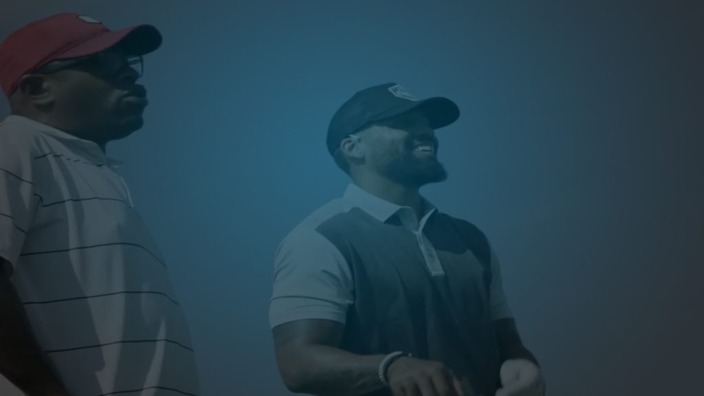Still of two golfers staring off in the distance in a Callaway spot. Producer's Toolbox cleared music for several Callaway spots.||