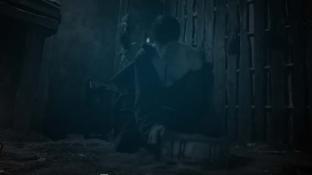 Still of a man kneeling and crying in a disheveled room in TV movie Dark Haul. Flavorlab Score's Erik Blicker wrote original music for the thriller.|