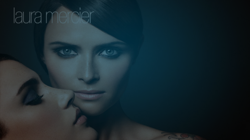 Still of a model staring at the camera and another with her eyes closed under the first in the lower left corner. Producer's Toolbox provided music supervision and music clearance services.