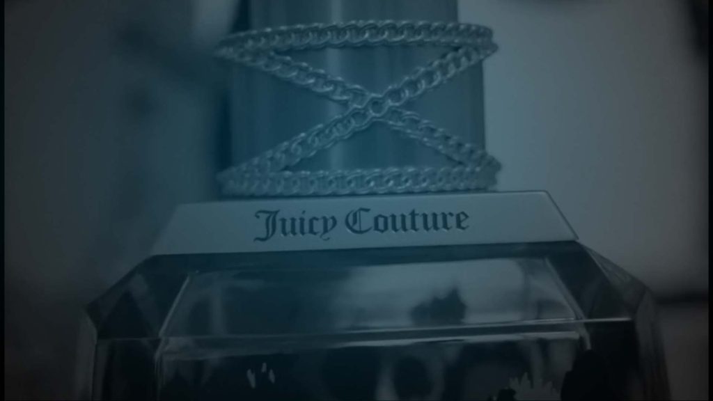 Still of Juicy Couture perfume commercials. Producer's Toolbox provided music clearance services for the spot.