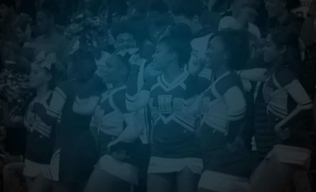 Still of a high school cheerleading team watching a girl being asked to prom from MTV's Promposal. Flavorlab Sound mixed the debut season of the show.