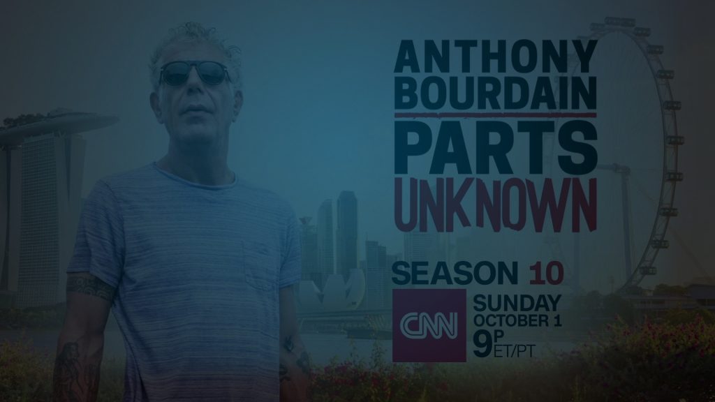 Still of Anthony Bourdain wearing sunglasses and facing towards the camera in front of a city skyline and ferris wheel. Flavorlab Score composed original music for the series.||Still of Anthony Bourdain staring above the camera wearing sunglasses in front of a city skyline and ferris wheel. Flavorlab Score provided original music for the series.|