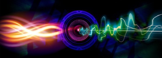 Image of orange and pink waves flowing through a speaker face and flowing out the other side as a green sound wave. Flavorlab is offering free sound effects.||