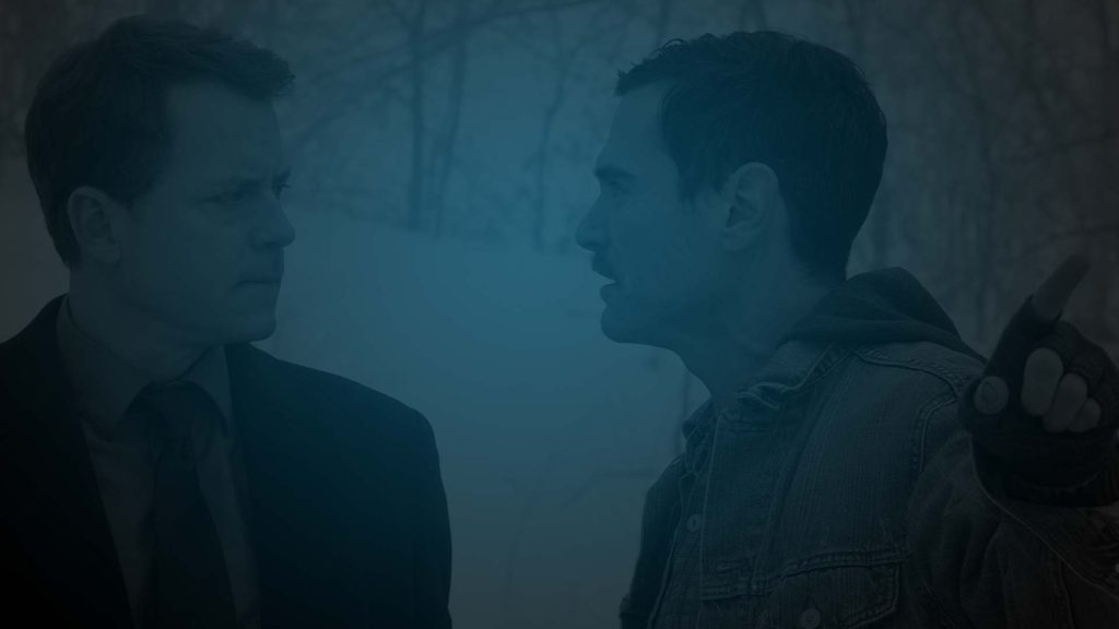 Still of Greg Kinnear from Thin Ice staring at another man. Flavorlab Score composed original music for the film's trailer.|